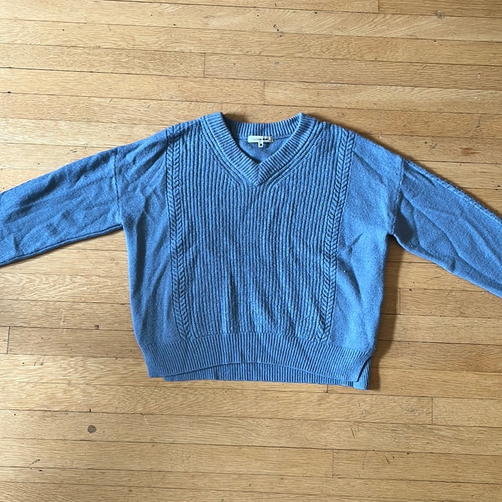 Womens, light blue, global work, knit sweater with various patterns.